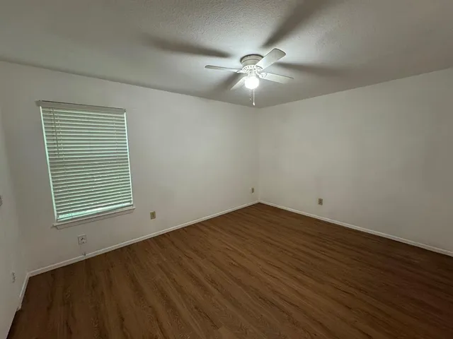 a bathroom with a shower and a toilet