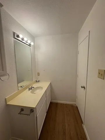 a white toilet sitting next to a bathroom sink