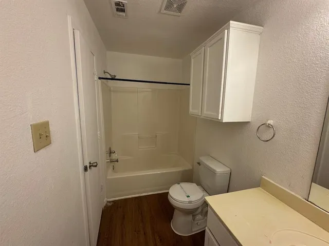 a view of hallway with wooden floor