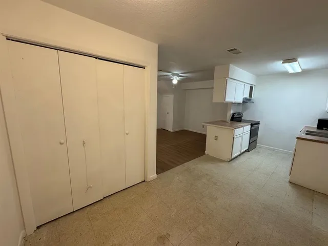 a view of kitchen and wooden floor