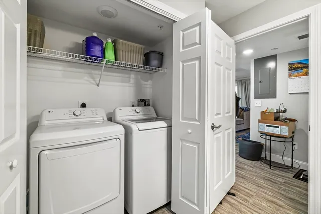a view of storage and utility room with washer and dryer