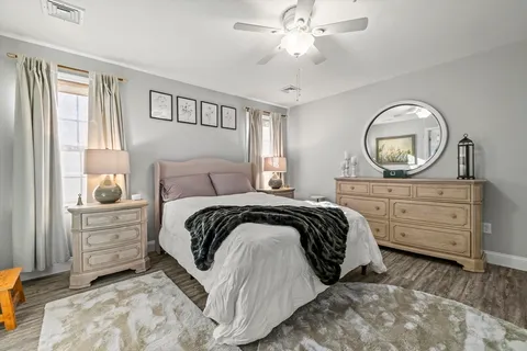 a bedroom with a bed and a dresser