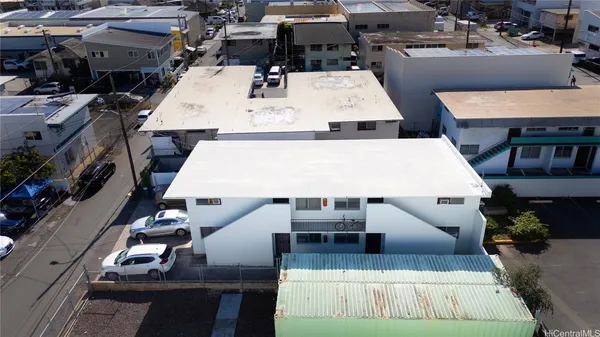 an aerial view of residential houses with outdoor space