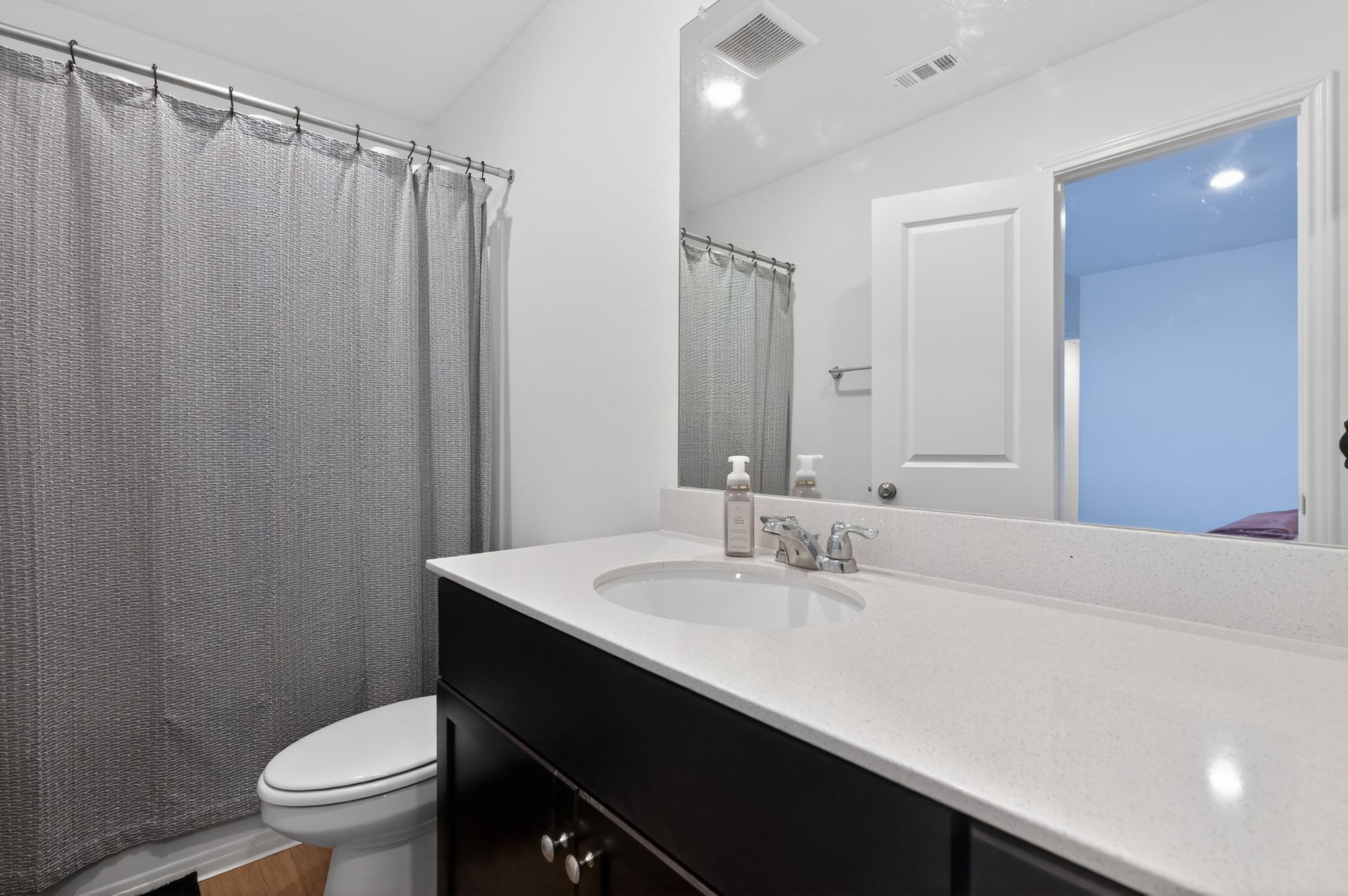 612 Marty Allen Loop Jarrell, TX 76537 - Photo 11 of 15 Bathroom with vanity and a shower with shower curtain
