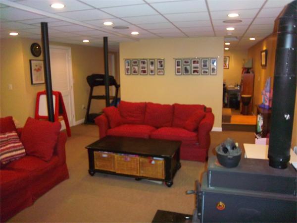 4 Circle Street Middleton, MA 01949 - Photo 11 of 19 a living room with furniture and a flat screen tv