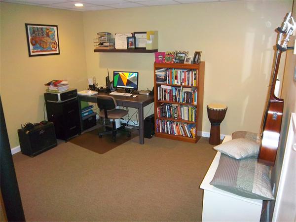 4 Circle Street Middleton, MA 01949 - Photo 12 of 19 a view of a workspace with furniture and book shelf