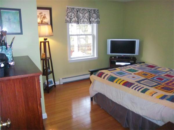 4 Circle Street Middleton, MA 01949 - Photo 17 of 19 a bedroom with a bed and a window