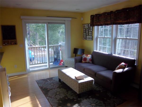 4 Circle Street Middleton, MA 01949 - Photo 8 of 19 a living room with furniture and a large window