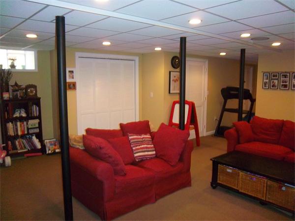 4 Circle Street Middleton, MA 01949 - Photo 9 of 19 a living room with furniture and a gym machine