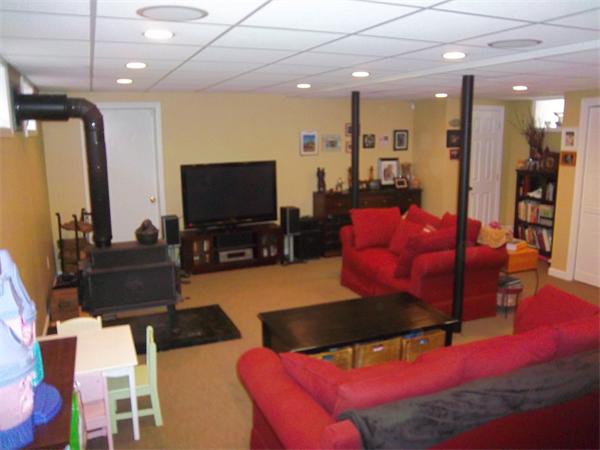 4 Circle Street Middleton, MA 01949 - Photo 10 of 19 a living room with furniture and a flat screen tv