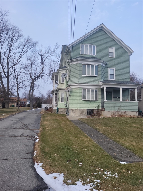 300 Read Street Somerset, MA 02726 - Photo 2 of 9 a front view of a house with a yard