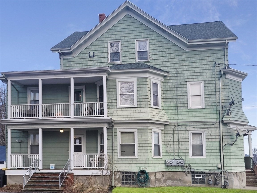 300 Read Street Somerset, MA 02726 - Photo 3 of 9 a front view of a house with glass windows
