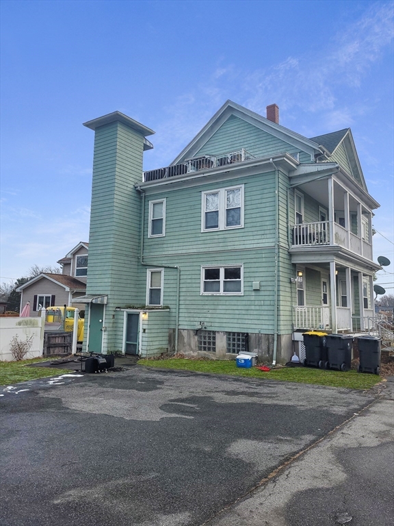 300 Read Street Somerset, MA 02726 - Photo 4 of 9 a front view of a house with a yard