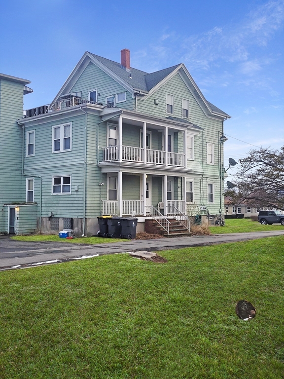 300 Read Street Somerset, MA 02726 - Photo 5 of 9 a front view of a house with swimming pool and chairs