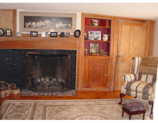 208 Great Road Stow, MA 01775 - Photo 3 of 9 a living room with furniture and a fireplace
