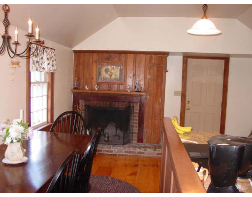208 Great Road Stow, MA 01775 - Photo 6 of 9 a living room with furniture and a fireplace