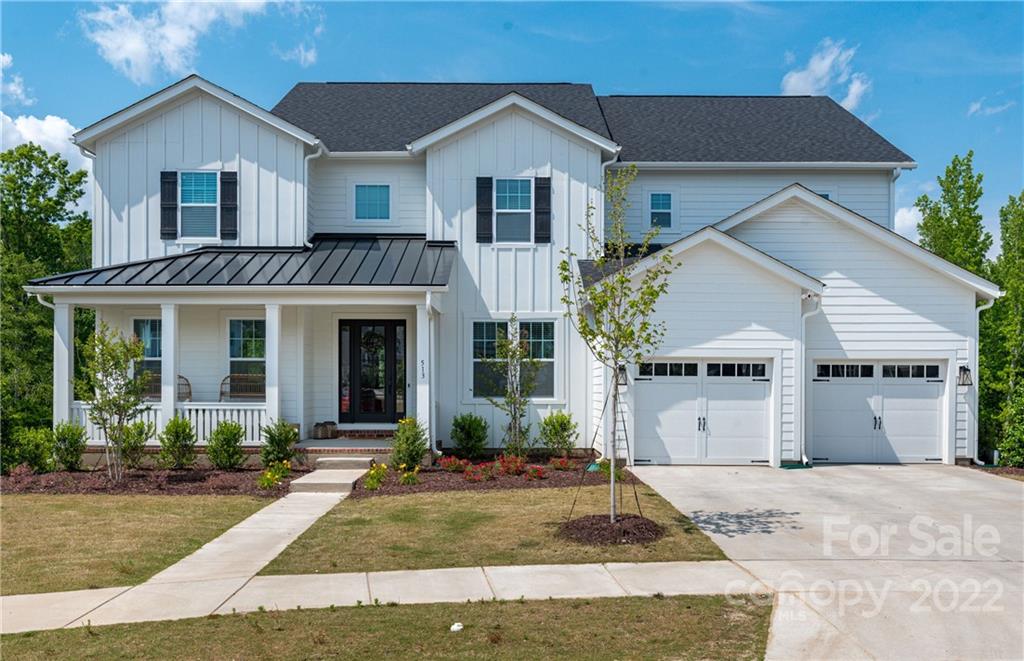 513 Small Batch Path Fort Mill, SC 29708 - Photo 1 of 48 a front view of a house with garden