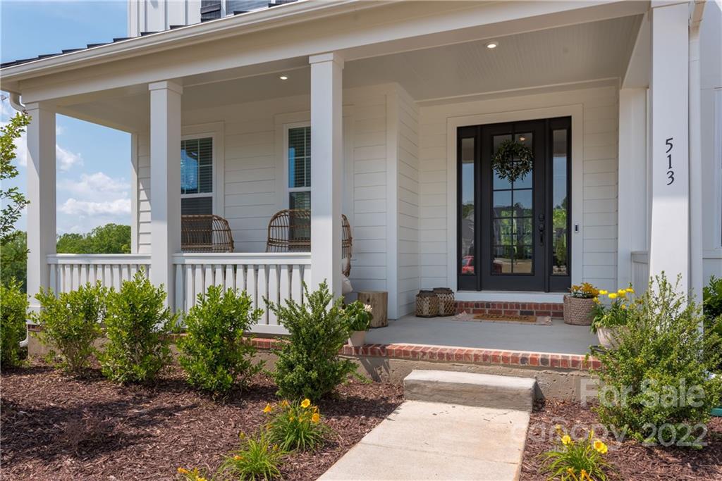 513 Small Batch Path Fort Mill, SC 29708 - Photo 2 of 48 a front view of a house with a garden