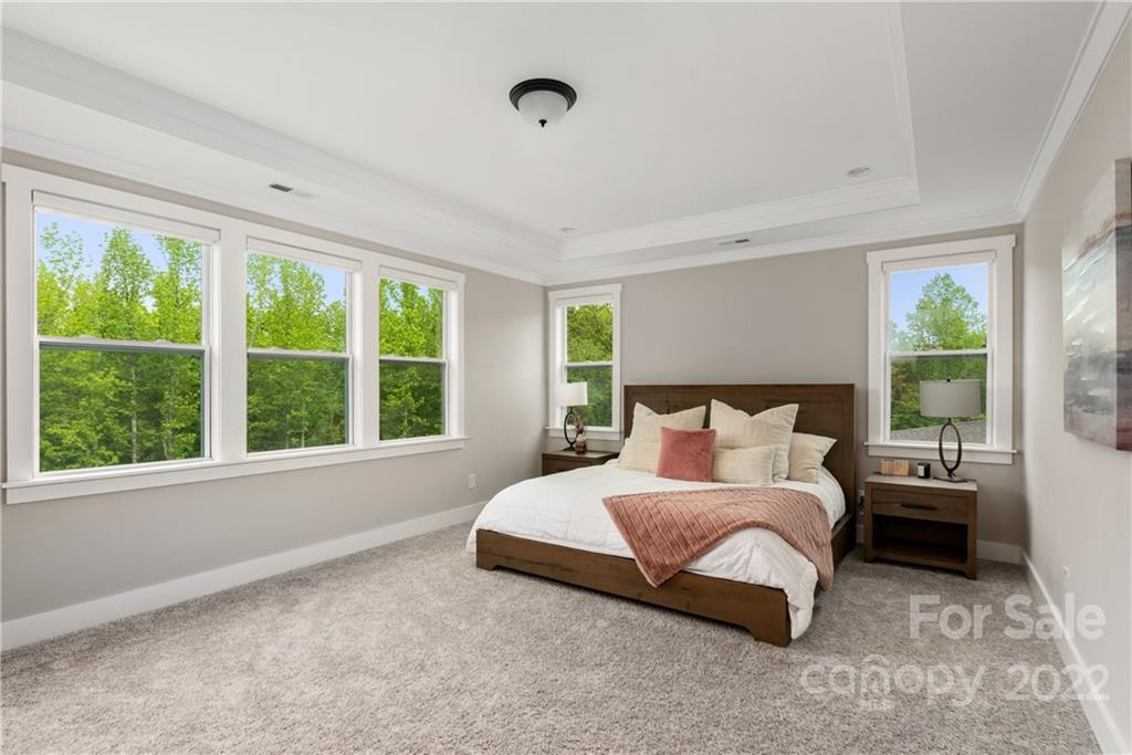 513 Small Batch Path Fort Mill, SC 29708 - Photo 23 of 48 a large bed sitting in a bedroom next to a window