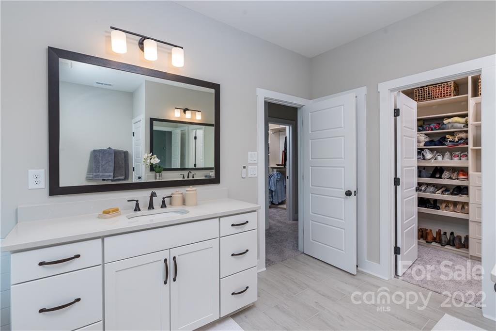 513 Small Batch Path Fort Mill, SC 29708 - Photo 26 of 48 a bathroom with double vanity sink and a mirror