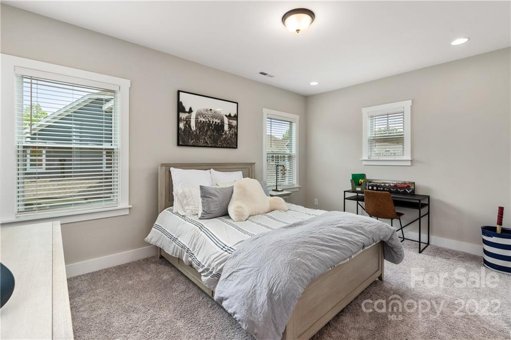 513 Small Batch Path Fort Mill, SC 29708 - Photo 28 of 48 a bedroom with a bed a wall painting and a window