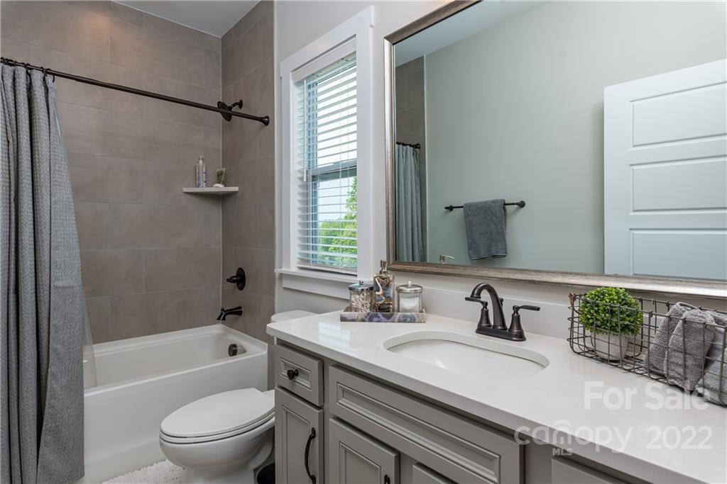513 Small Batch Path Fort Mill, SC 29708 - Photo 36 of 48 a bathroom with a granite countertop sink toilet and shower