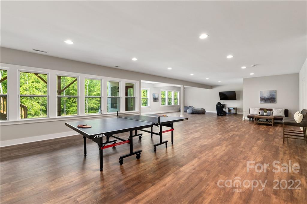 513 Small Batch Path Fort Mill, SC 29708 - Photo 38 of 48 a room with lots of furniture wooden floor and windows