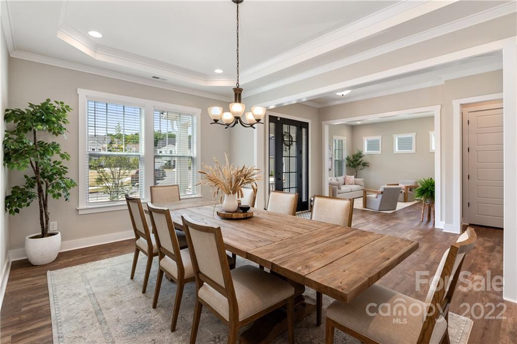 513 Small Batch Path Fort Mill, SC 29708 - Photo 5 of 48 a view of a dining room with furniture window and wooden floor