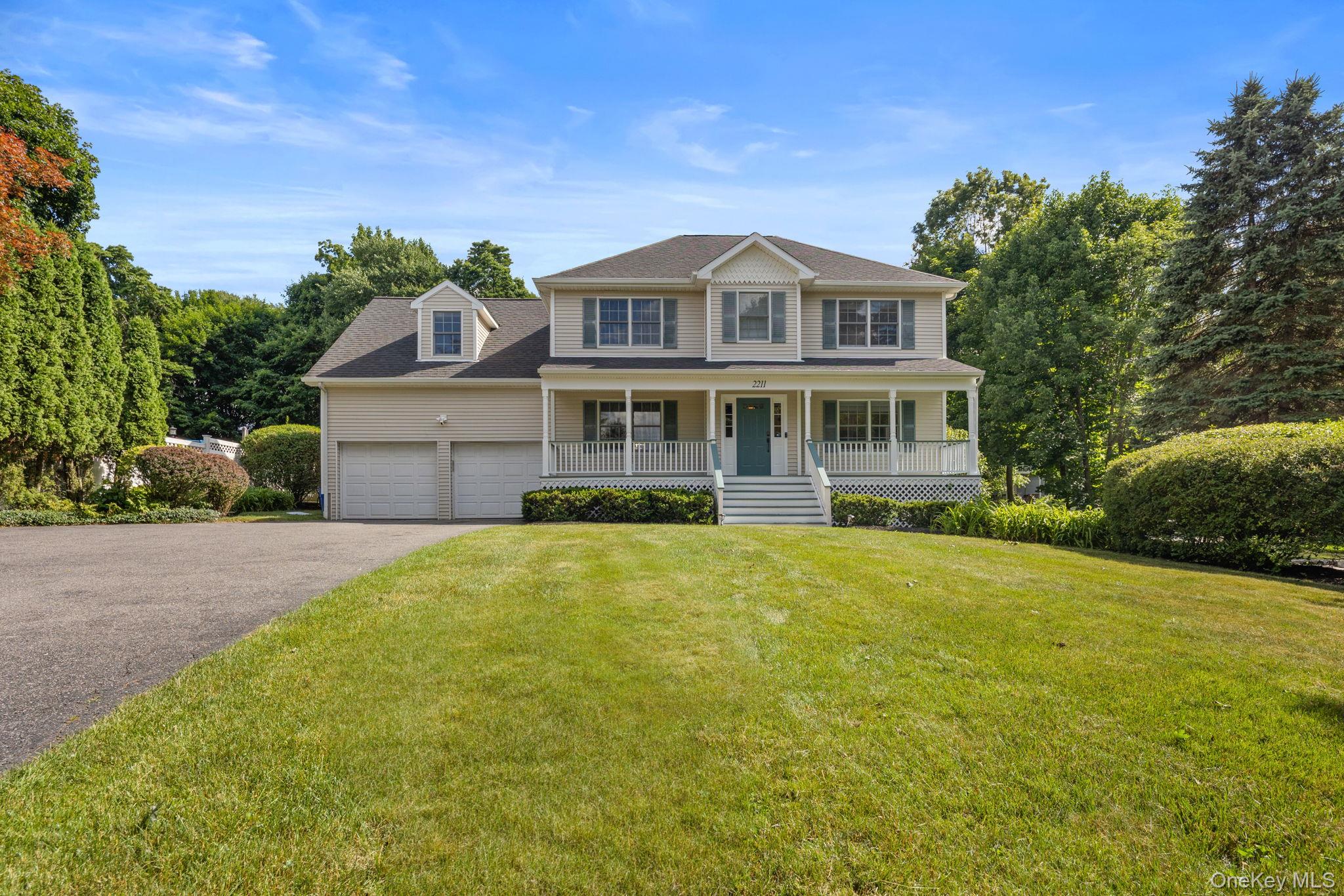 2211 Crompond Road Yorktown Heights, NY 10598 - Photo 2 of 38 a front view of a house with a yard