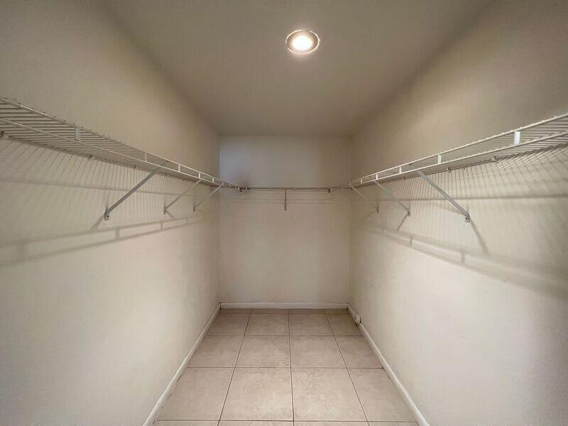 10225 Northwest 33rd Street Sunrise, FL 33351 - Photo 2 of 51 a view of a room with racks on the wall