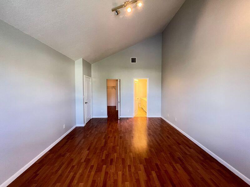 10225 Northwest 33rd Street Sunrise, FL 33351 - Photo 23 of 51 a view of an empty room with wooden floor