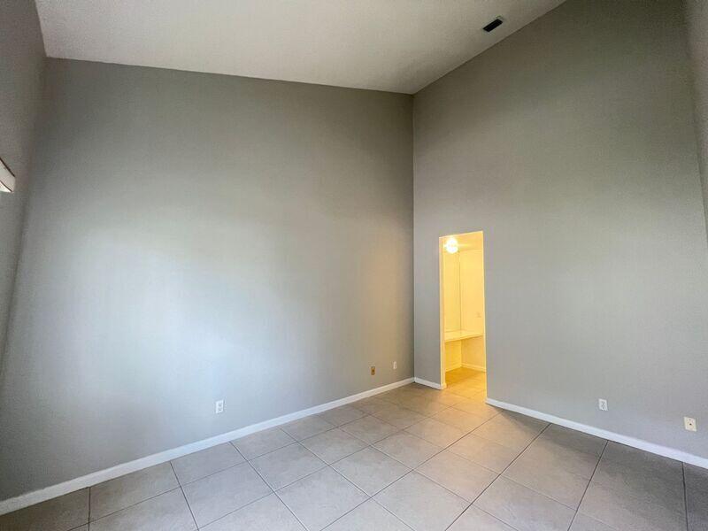10225 Northwest 33rd Street Sunrise, FL 33351 - Photo 25 of 51 an empty room with a window