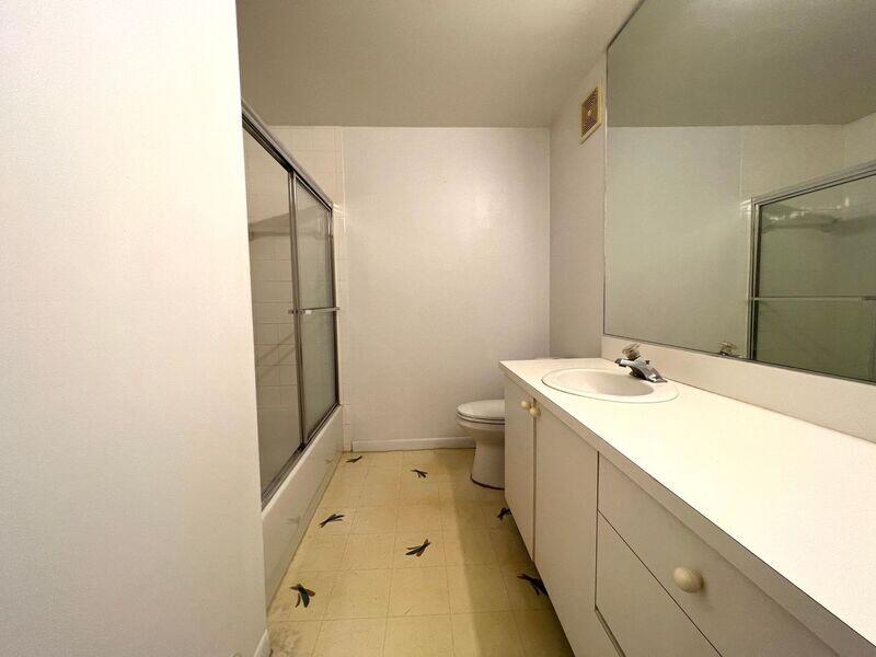 10225 Northwest 33rd Street Sunrise, FL 33351 - Photo 26 of 51 a bathroom with a sink and mirror with toilet