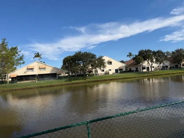 an aerial view of a house with a lake view