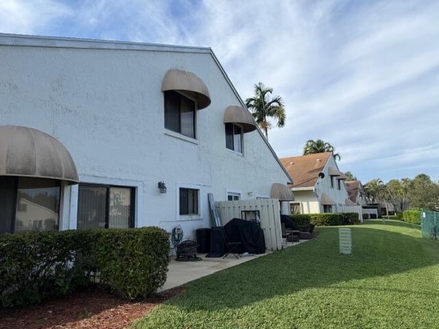 10225 Northwest 33rd Street Sunrise, FL 33351 - Photo 31 of 51 a front view of a house with a garden