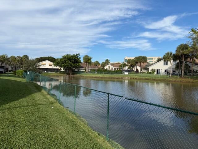 10225 Northwest 33rd Street Sunrise, FL 33351 - Photo 32 of 51 a view of a lake with houses in the back