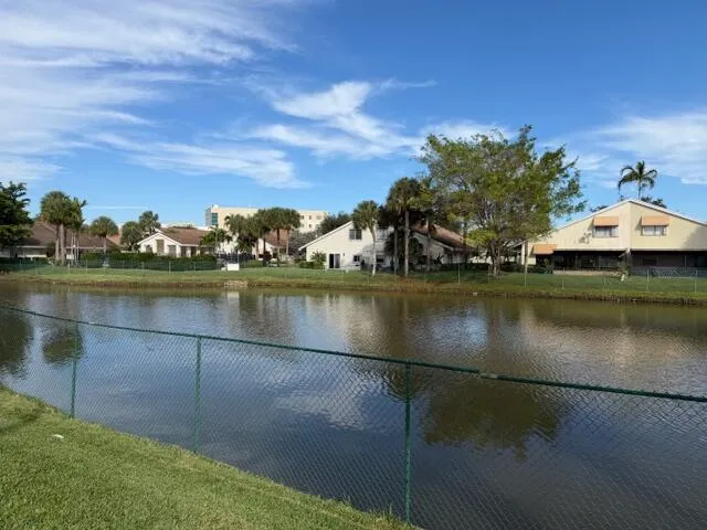 a view of a lake with houses in the back