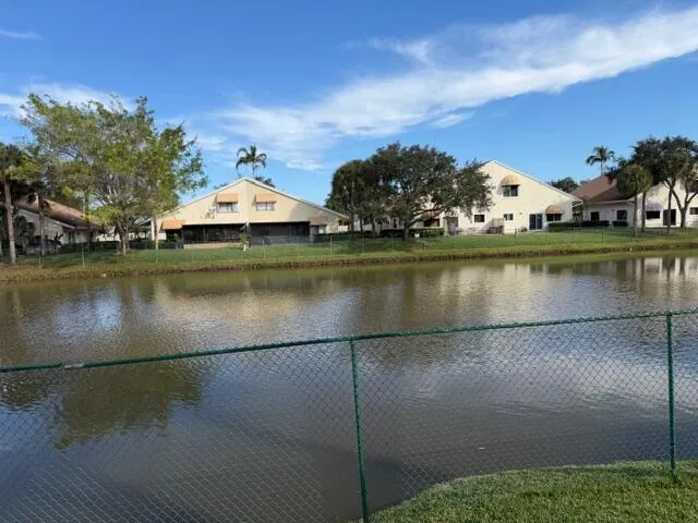 an aerial view of a house with a yard lake view and mountain view