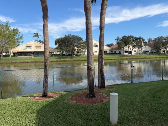 10225 Northwest 33rd Street Sunrise, FL 33351 - Photo 42 of 51 a lake view with a garden and trees