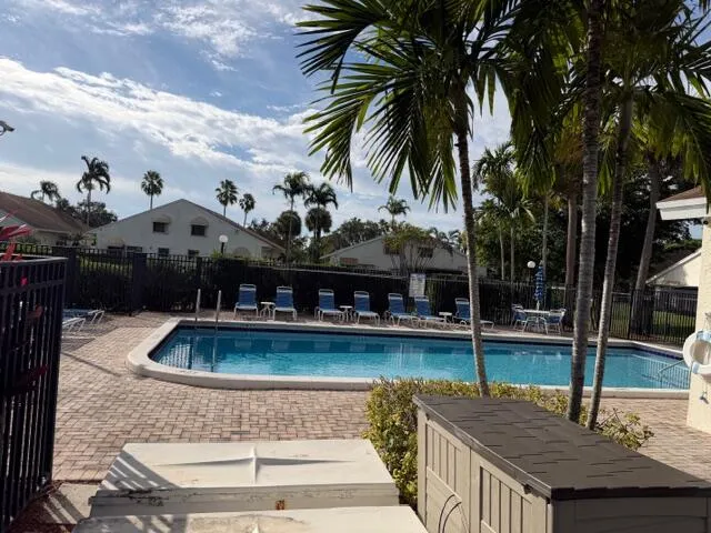 a view of outdoor space with swimming pool and porch