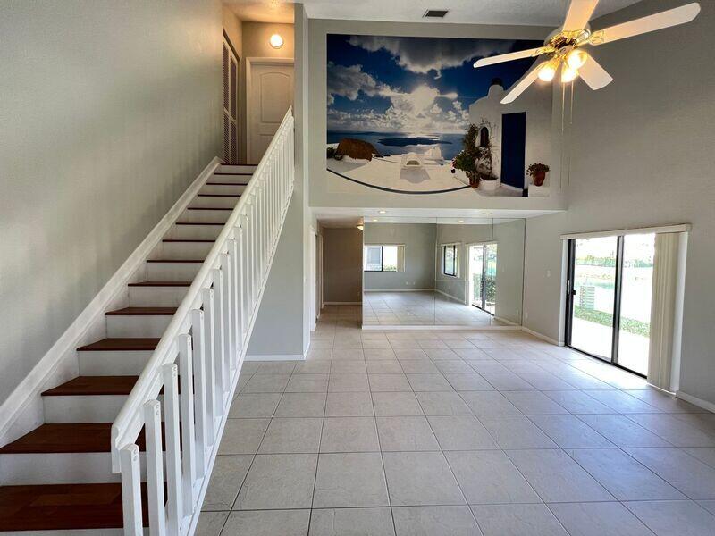 10225 Northwest 33rd Street Sunrise, FL 33351 - Photo 6 of 51 a view of entryway and hall with wooden floor