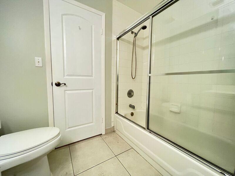 10225 Northwest 33rd Street Sunrise, FL 33351 - Photo 8 of 51 a bathroom with a shower and a toilet