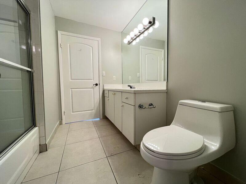 10225 Northwest 33rd Street Sunrise, FL 33351 - Photo 10 of 51 a bathroom with a toilet sink and mirror