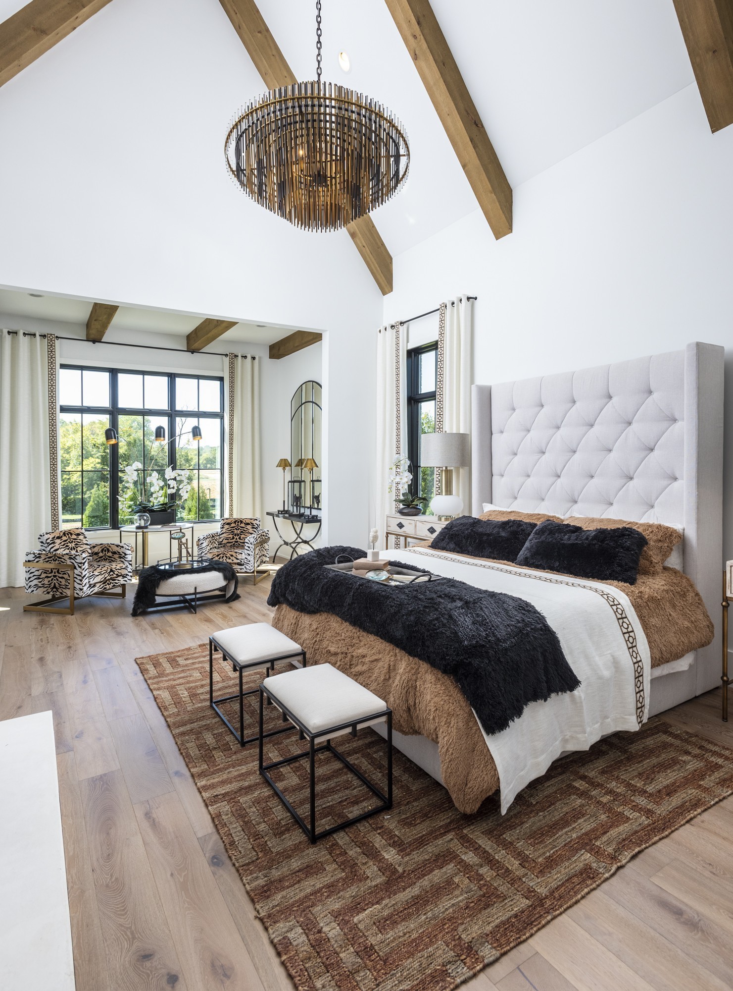 1553 Sunset Road Brentwood, TN 37027 - Photo 12 of 31 a spacious bedroom with a large bed and a chandelier