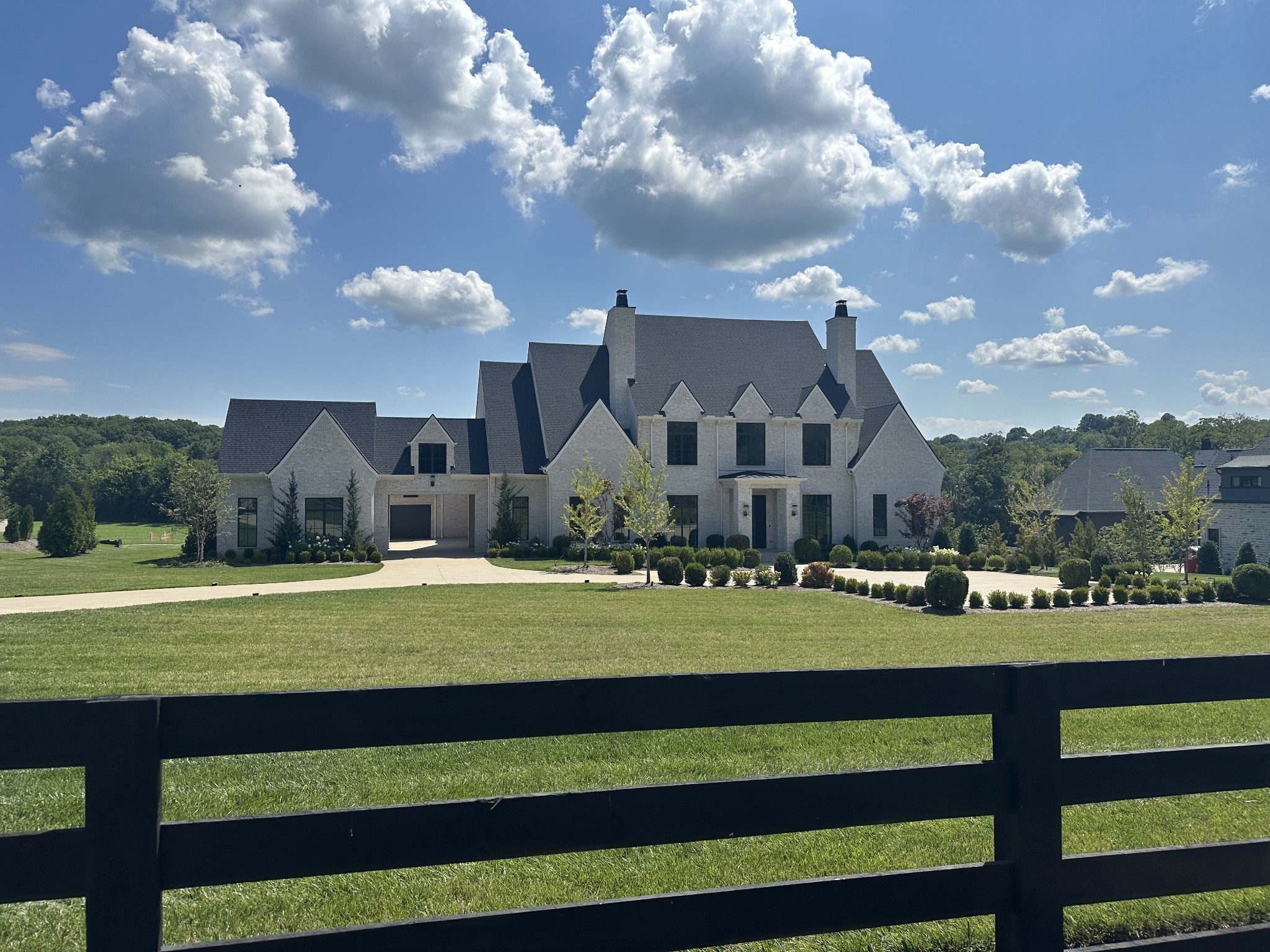 1553 Sunset Road Brentwood, TN 37027 - Photo 5 of 31 a view of a big house with a big yard and large trees