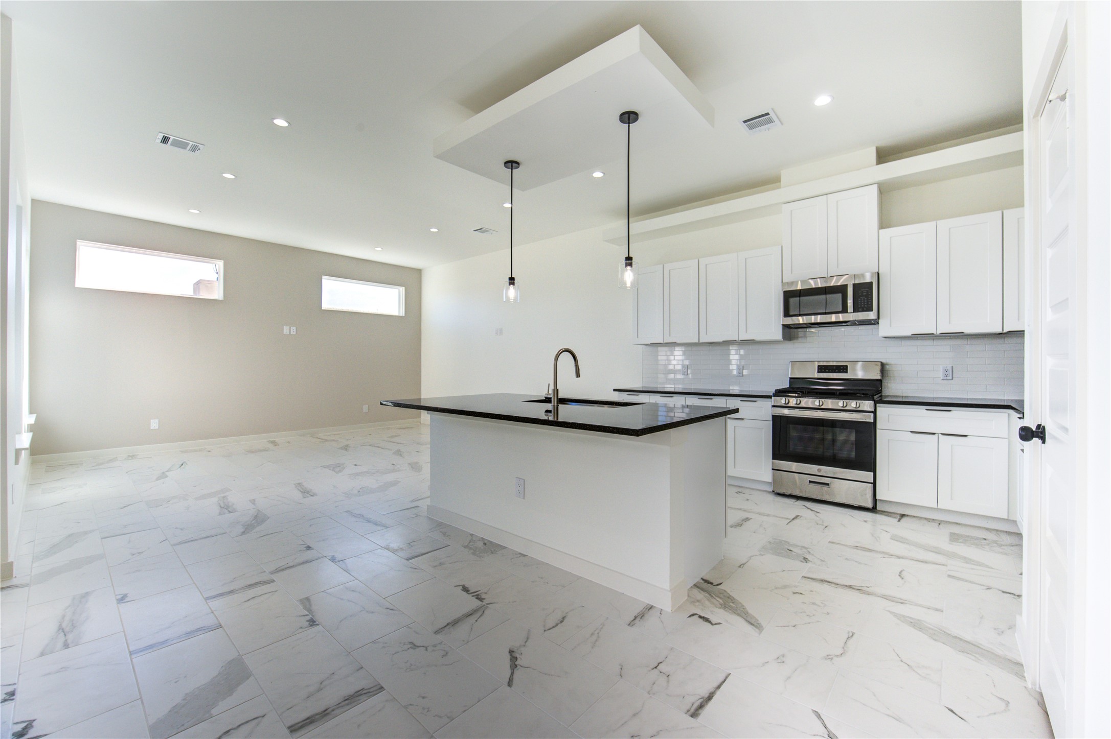 2931 El Fenice Lane Houston, TX 77057 - Photo 12 of 46 a kitchen with stainless steel appliances granite countertop a stove a sink and a refrigerator