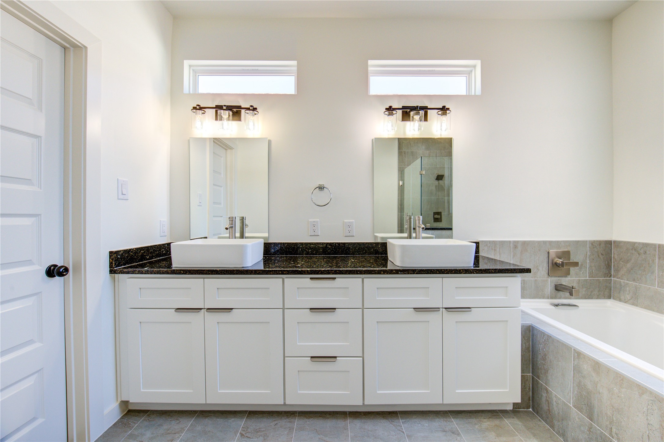 2931 El Fenice Lane Houston, TX 77057 - Photo 31 of 46 a bathroom with double sink and a mirror