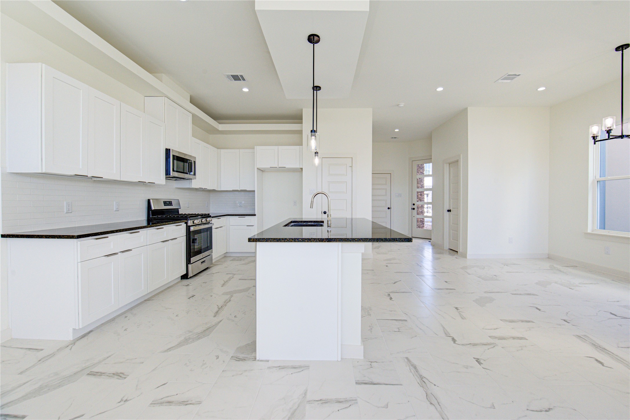 2931 El Fenice Lane Houston, TX 77057 - Photo 7 of 46 a kitchen with stainless steel appliances granite countertop a refrigerator sink and cabinets