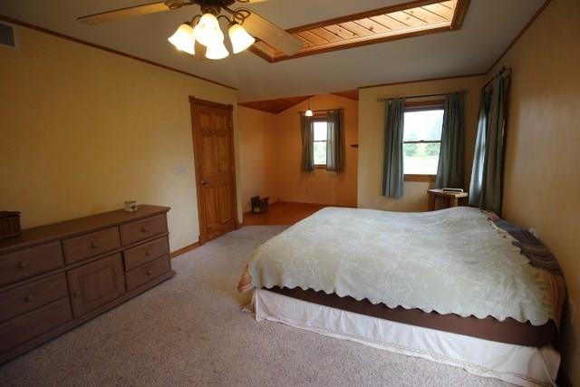 742 North River Road Ridott, IL 61067 - Photo 11 of 25 a spacious bedroom with a bed and a window