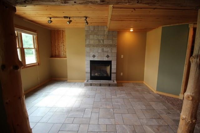 742 North River Road Ridott, IL 61067 - Photo 14 of 25 a view of an empty room with a fireplace